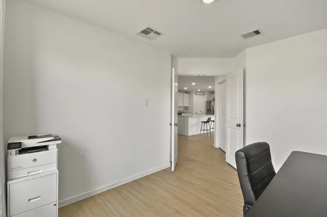 a view of kitchen with furniture and wooden floor