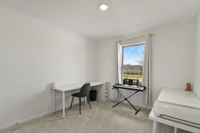 a view of a workspace with furniture