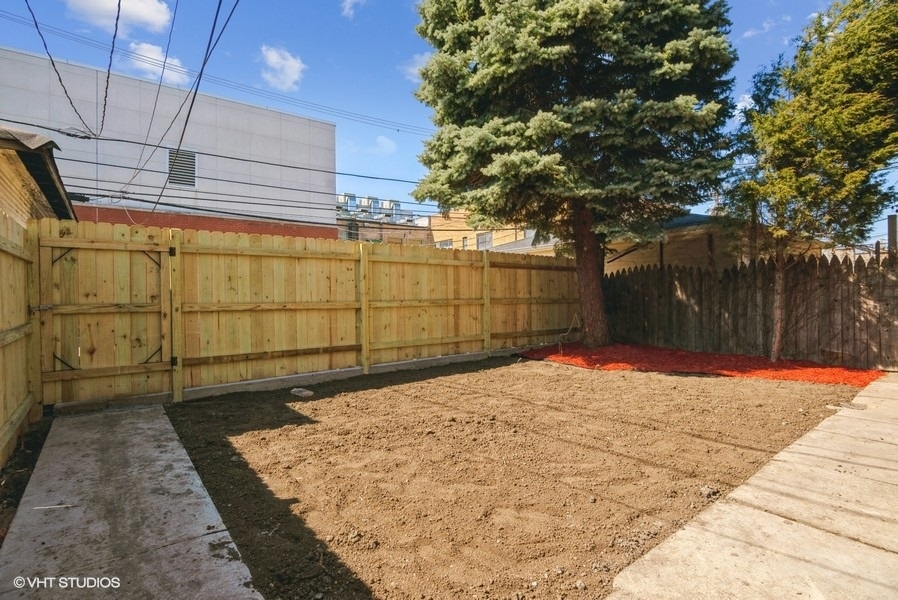 4740 North Troy Street, Unit 1 Chicago, IL 60625 - Photo 11 of 11 a backyard of a house