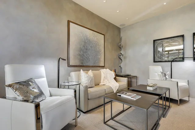 a living room with furniture and a lamp