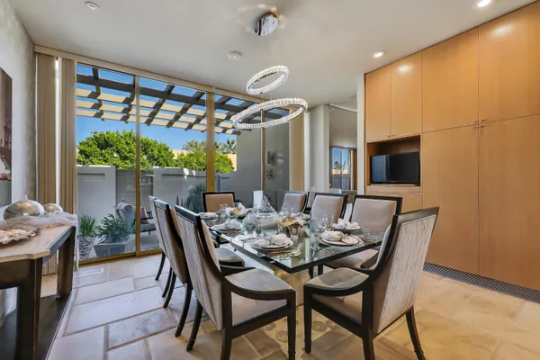 a dining room with furniture and window