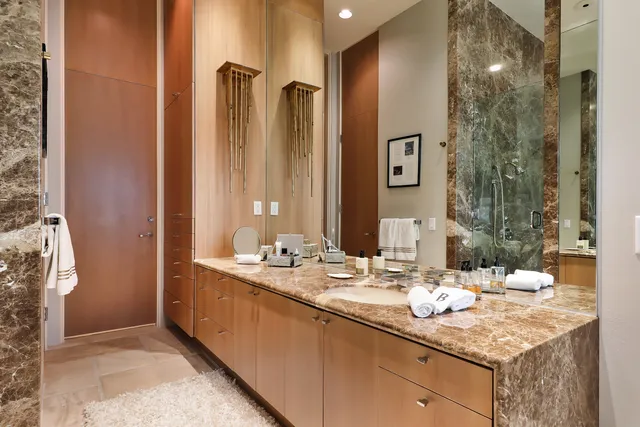 a bathroom with a sink double vanity and a mirror
