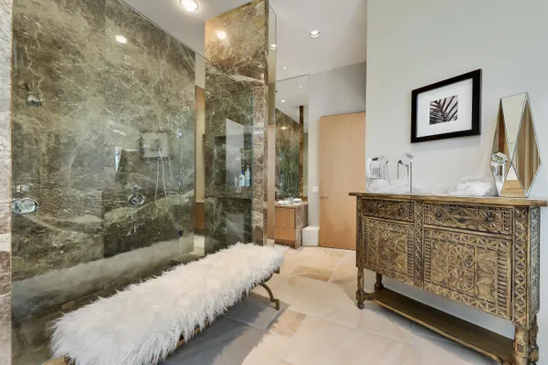 a spacious bathroom with double vanity sink a mirror and a shower