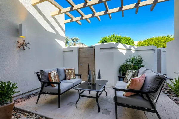 a patio with table and chairs