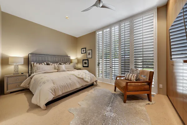 a bedroom with a bed and a couch