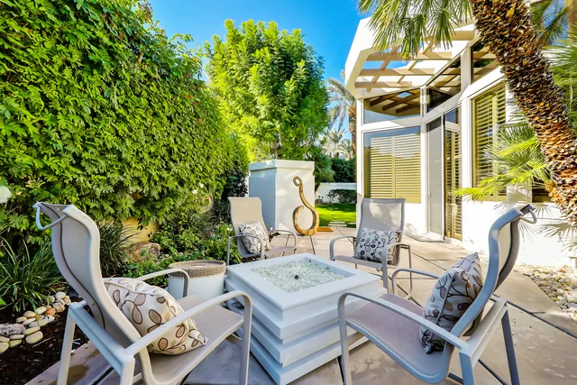 a patio with table and chairs