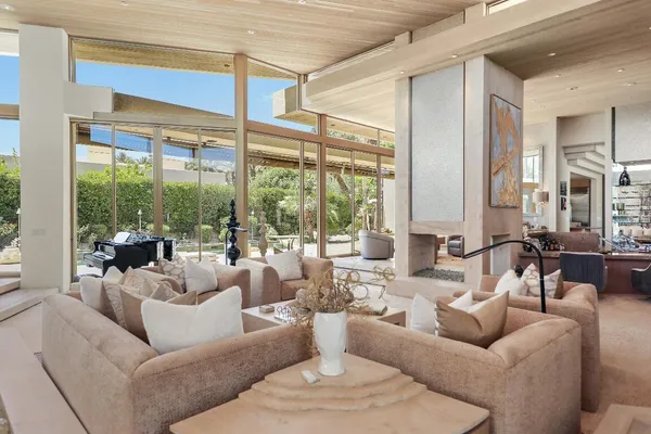 a living room with furniture and a large window