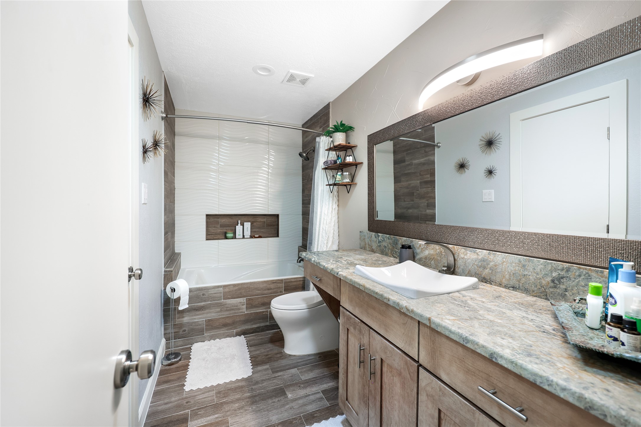 28831 South Diamondhead Conroe, TX 77356 - Photo 13 of 29 a spacious bathroom with a granite countertop sink and a mirror