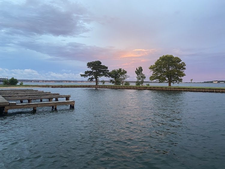 28831 South Diamondhead Conroe, TX 77356 - Photo 23 of 29 a view of a lake with houses in the back