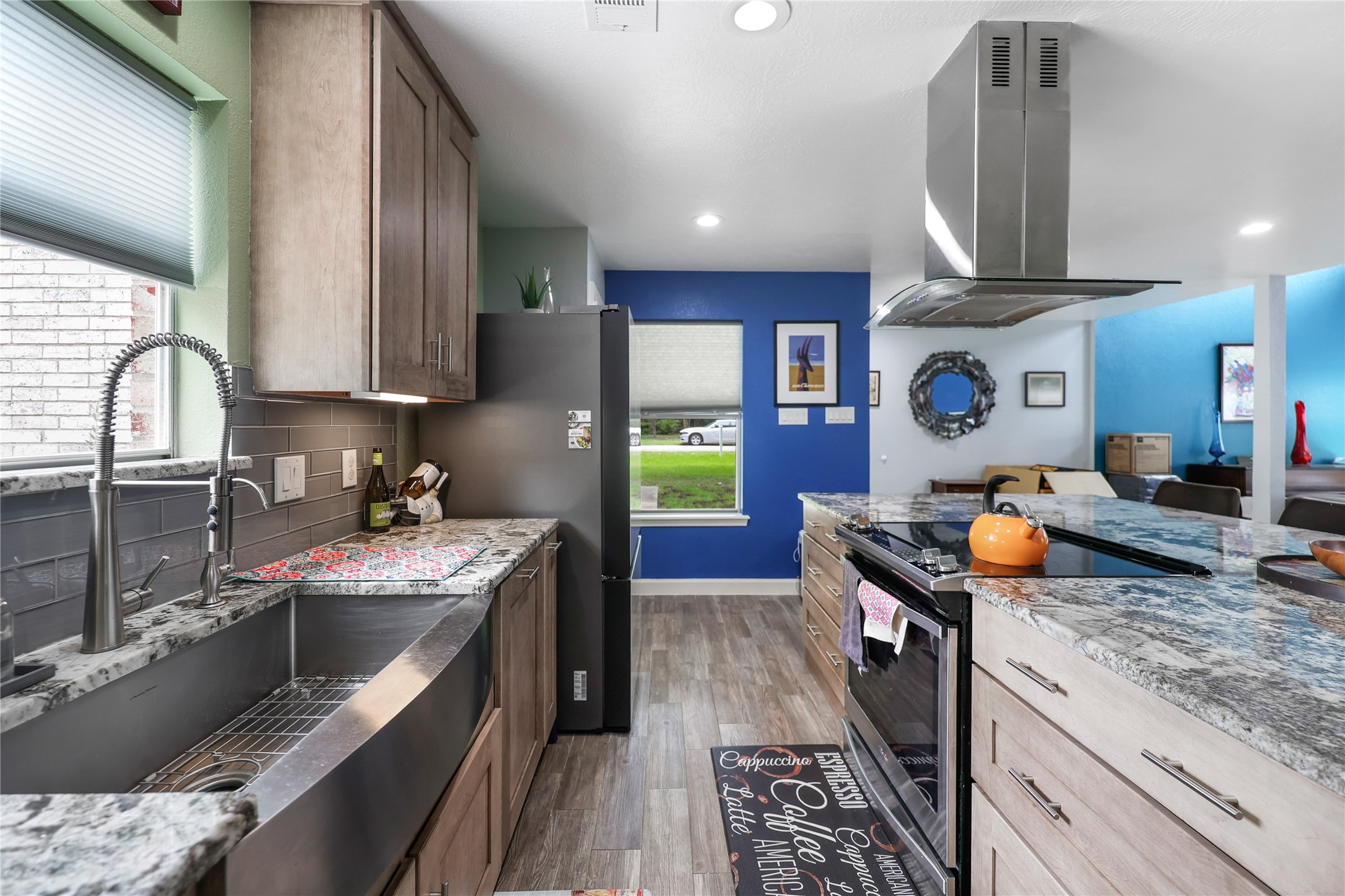 28831 South Diamondhead Conroe, TX 77356 - Photo 7 of 29 a kitchen with stainless steel appliances granite countertop a stove and a sink