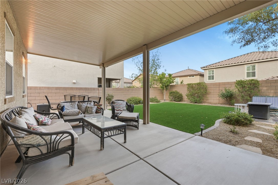 150 Fulgora Street Henderson, NV 89074 - Photo 55 of 92 Fenced backyard with outdoor lounge area and a patio
