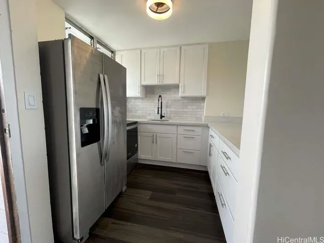 a kitchen with a refrigerator a sink and dishwasher