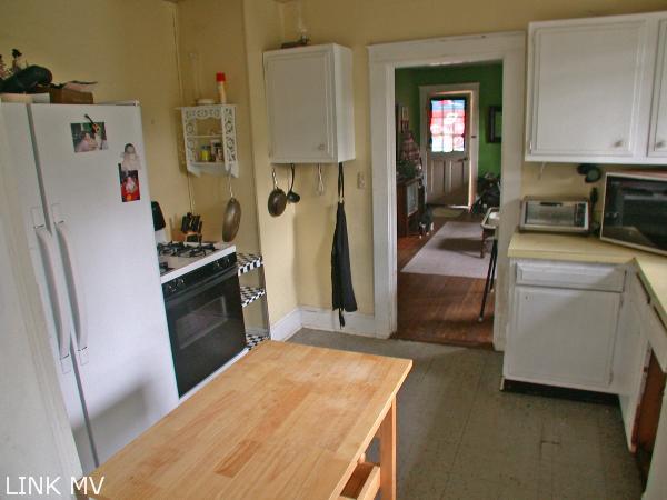 8 Wing Road Oak Bluffs, MA 02557 - Photo 3 of 9 Kitchen to the living room.