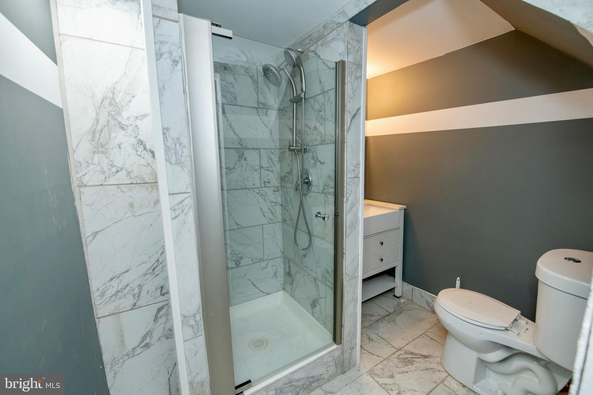 4930 Pulaski Avenue Philadelphia, PA 19144 - Photo 13 of 22 a bathroom with a shower and a toilet