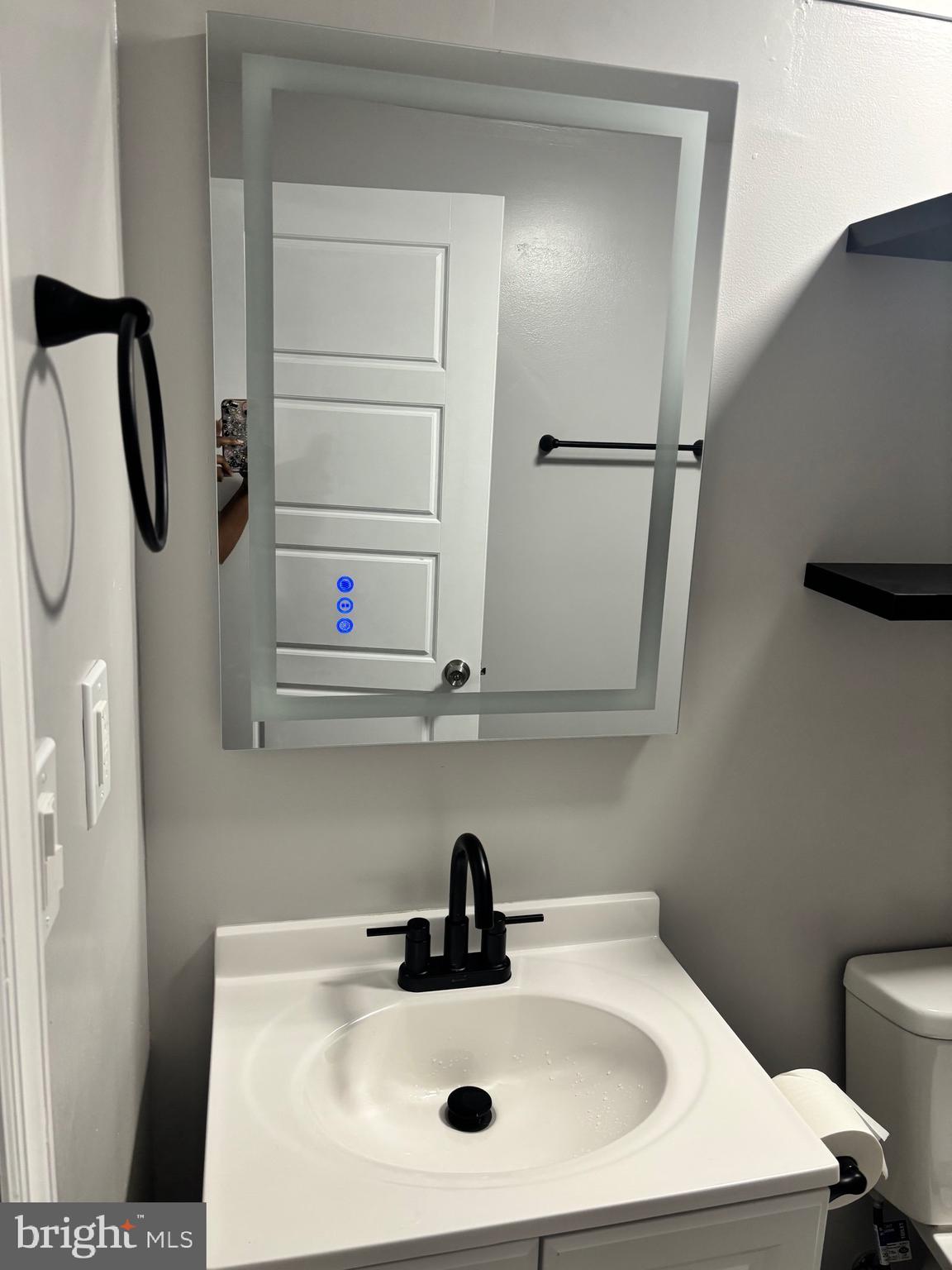 4930 Pulaski Avenue Philadelphia, PA 19144 - Photo 20 of 22 a bathroom with a sink and mirror
