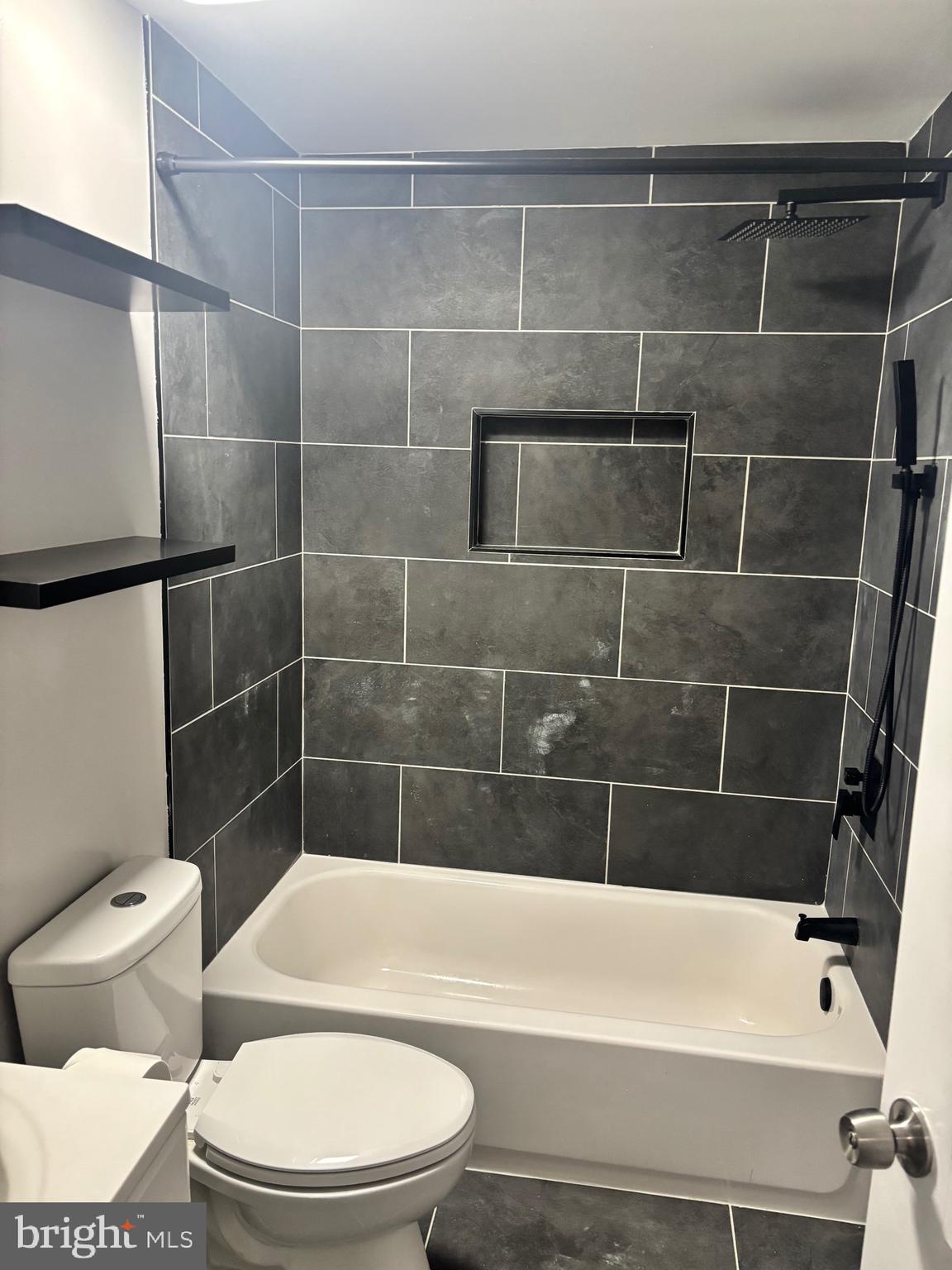 4930 Pulaski Avenue Philadelphia, PA 19144 - Photo 21 of 22 a bathroom with a toilet and a bath tub