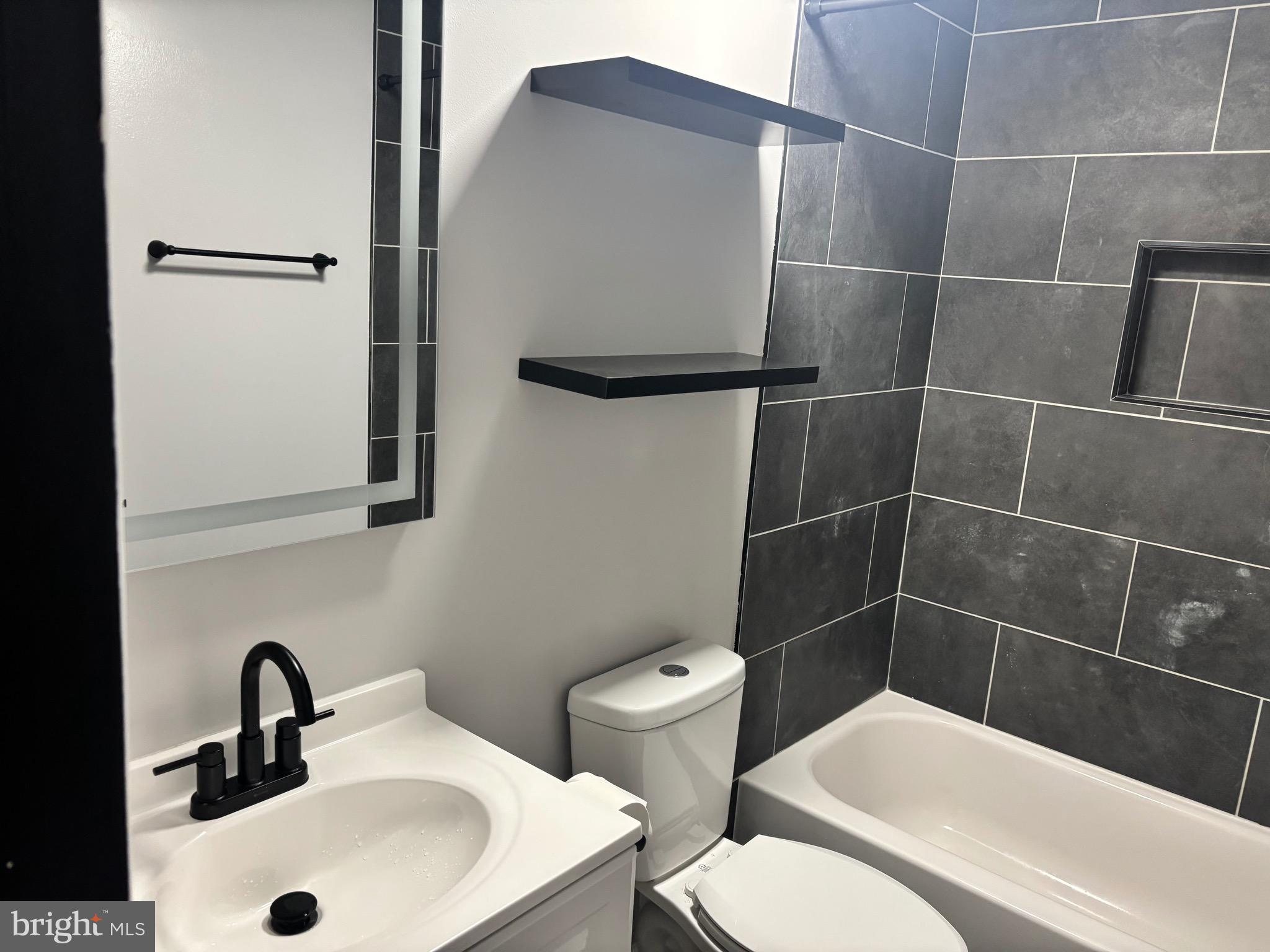 4930 Pulaski Avenue Philadelphia, PA 19144 - Photo 22 of 22 a bathroom with a sink toilet and shower