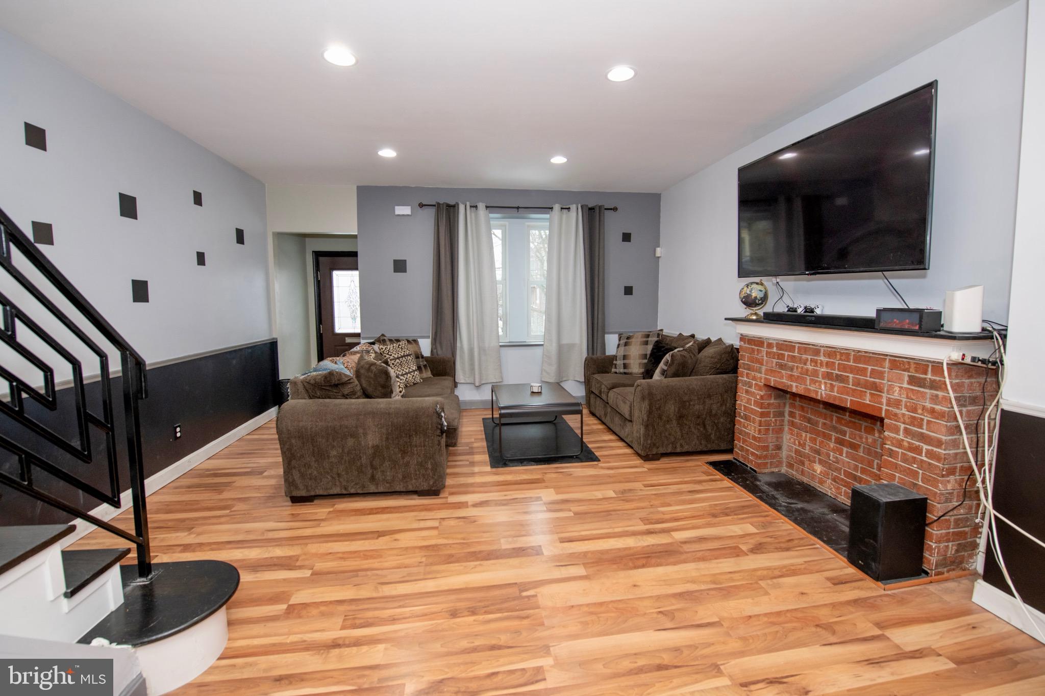 4930 Pulaski Avenue Philadelphia, PA 19144 - Photo 4 of 21 a living room with furniture and a flat screen tv