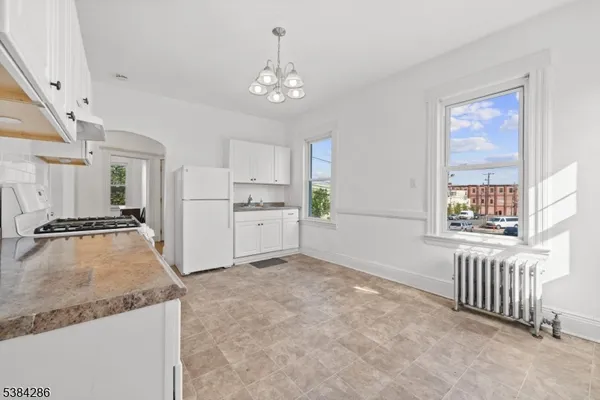 a view of a kitchen with a sink cabinets and outdoor space