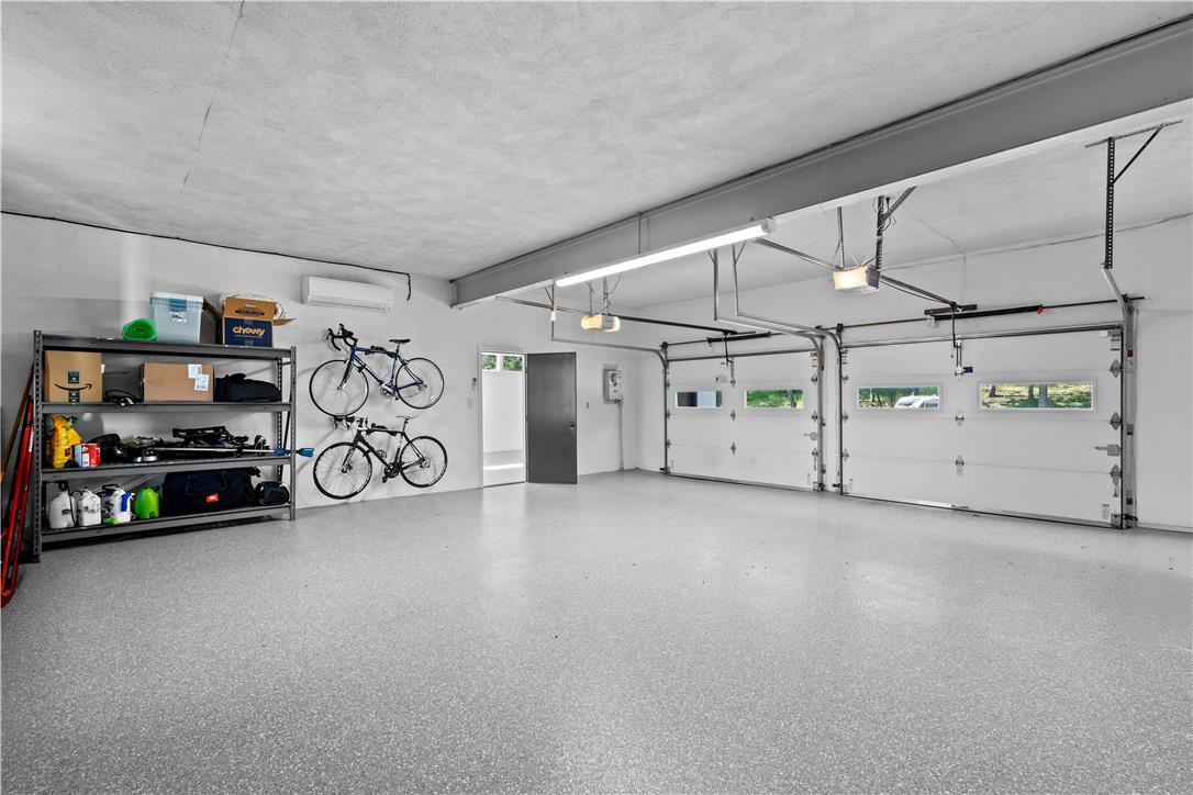 1506 Pleasant View Road Coopersburg, PA 18036 - Photo 77 of 97 Two automatic overhead doors access a spotless, spacious garage with durable speckled flooring.