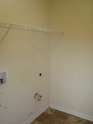 a view of a room with empty racks on the wall