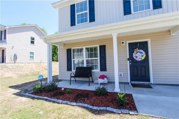 a front view of a house with porch
