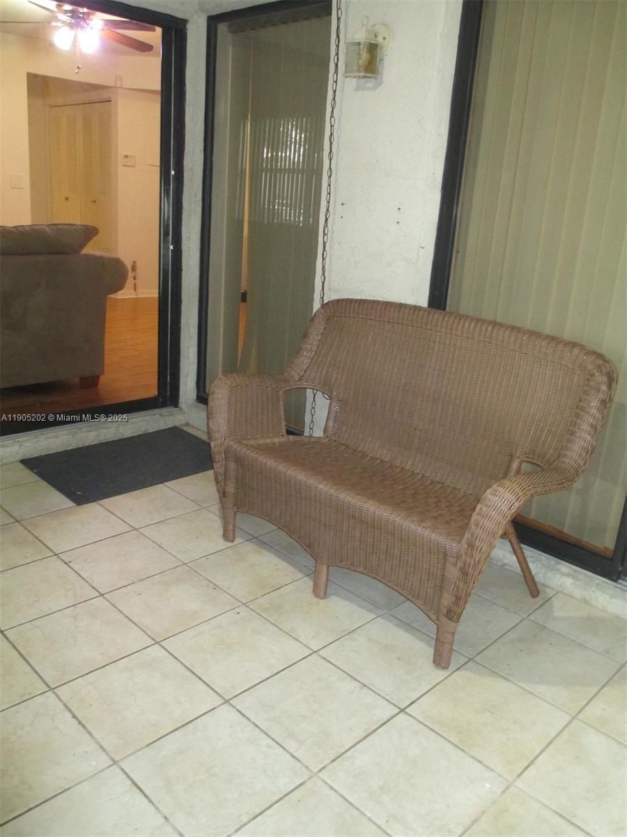 11532 Northwest 10th Street, Unit 11532 Pembroke Pines, FL 33026 - Photo 16 of 16 a living room with a couch