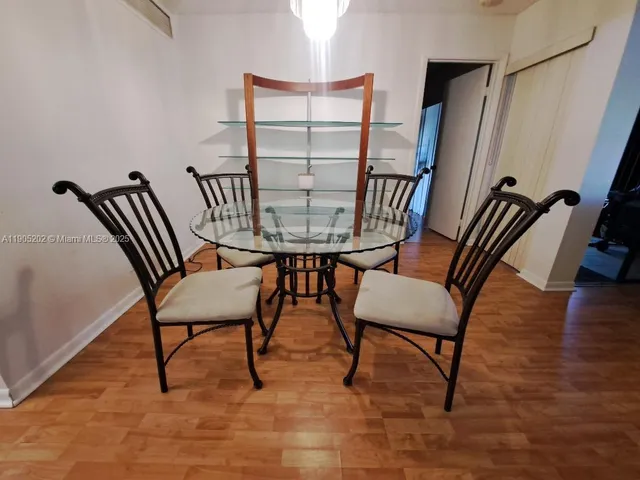 a view of a livingroom with furniture and a table and chair