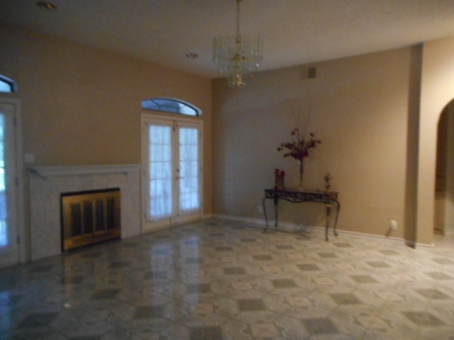 712 Merlin Road Laredo, TX 78041 - Photo 3 of 9 a view of livingroom with furniture and fireplace