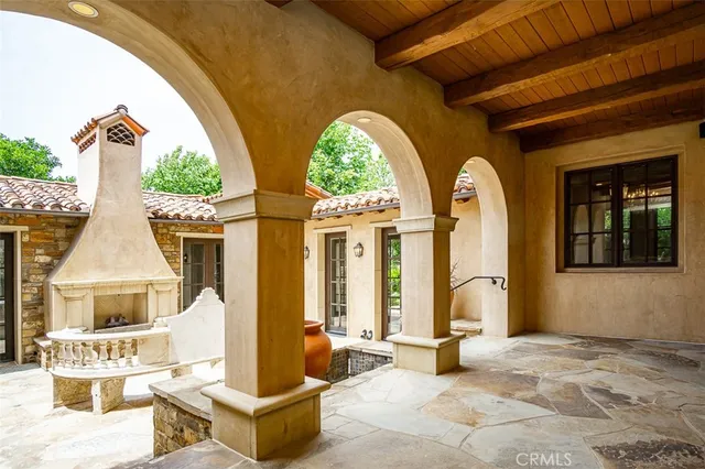 a building outdoor space with glass windows and couches