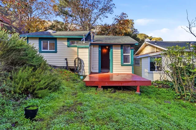 a front view of a house with a yard and porch