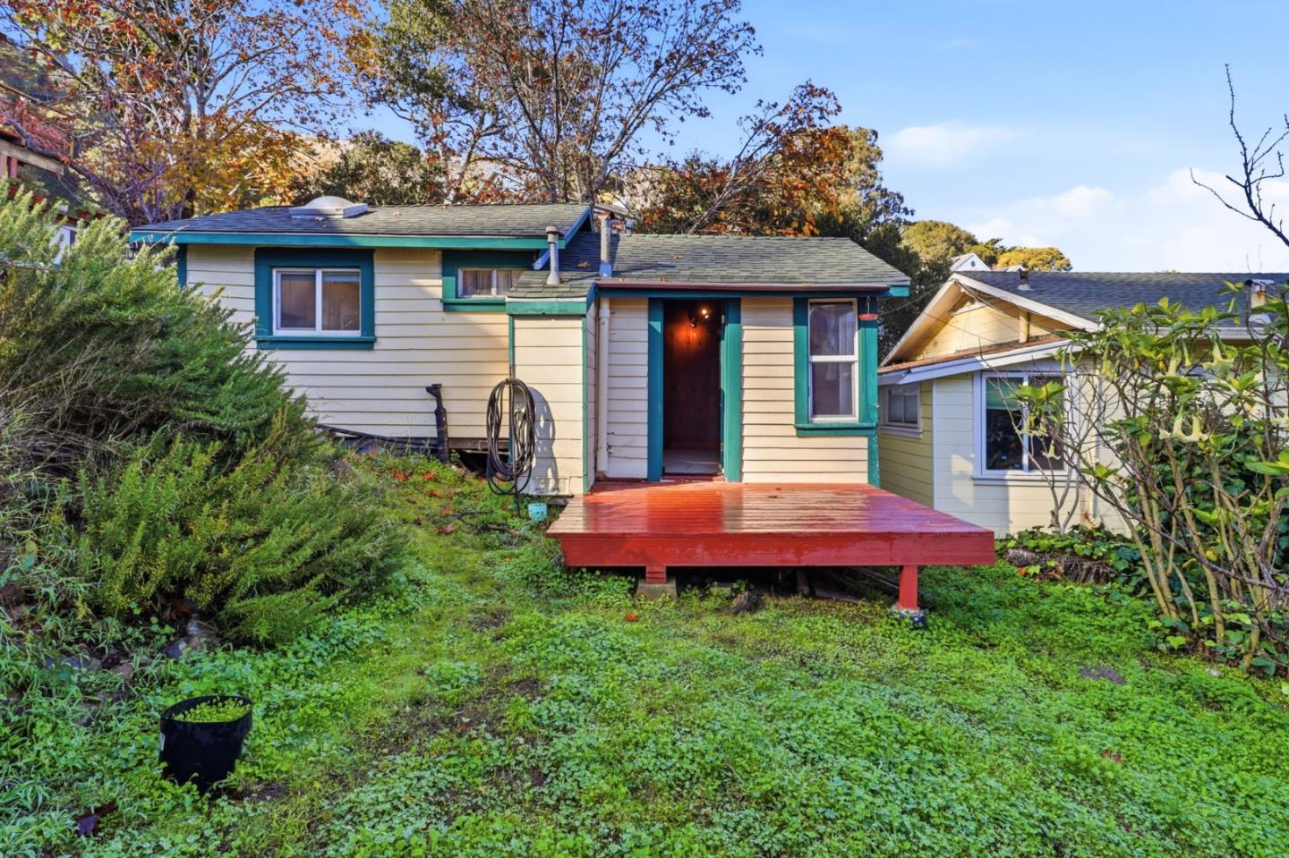 a front view of a house with a yard and porch