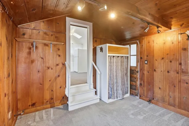 a view of a door with wooden walls