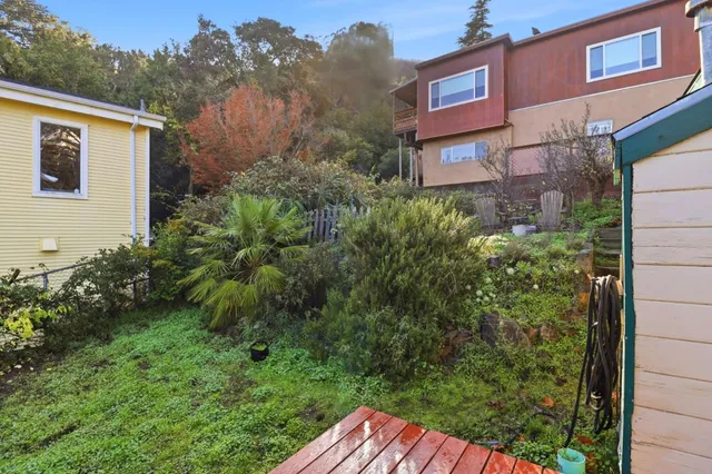 a view of a brick building next to a yard