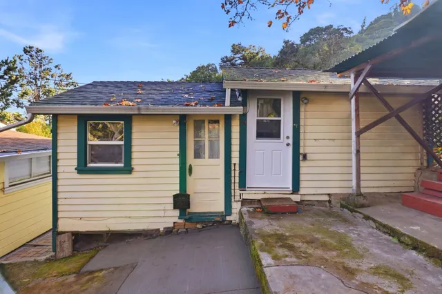a view of house with a porch