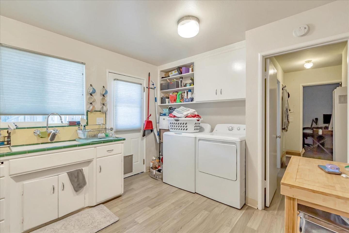 22620 Alcalde Road Cupertino, CA 95014 - Photo 12 of 39 a room with a sink and a refrigerator