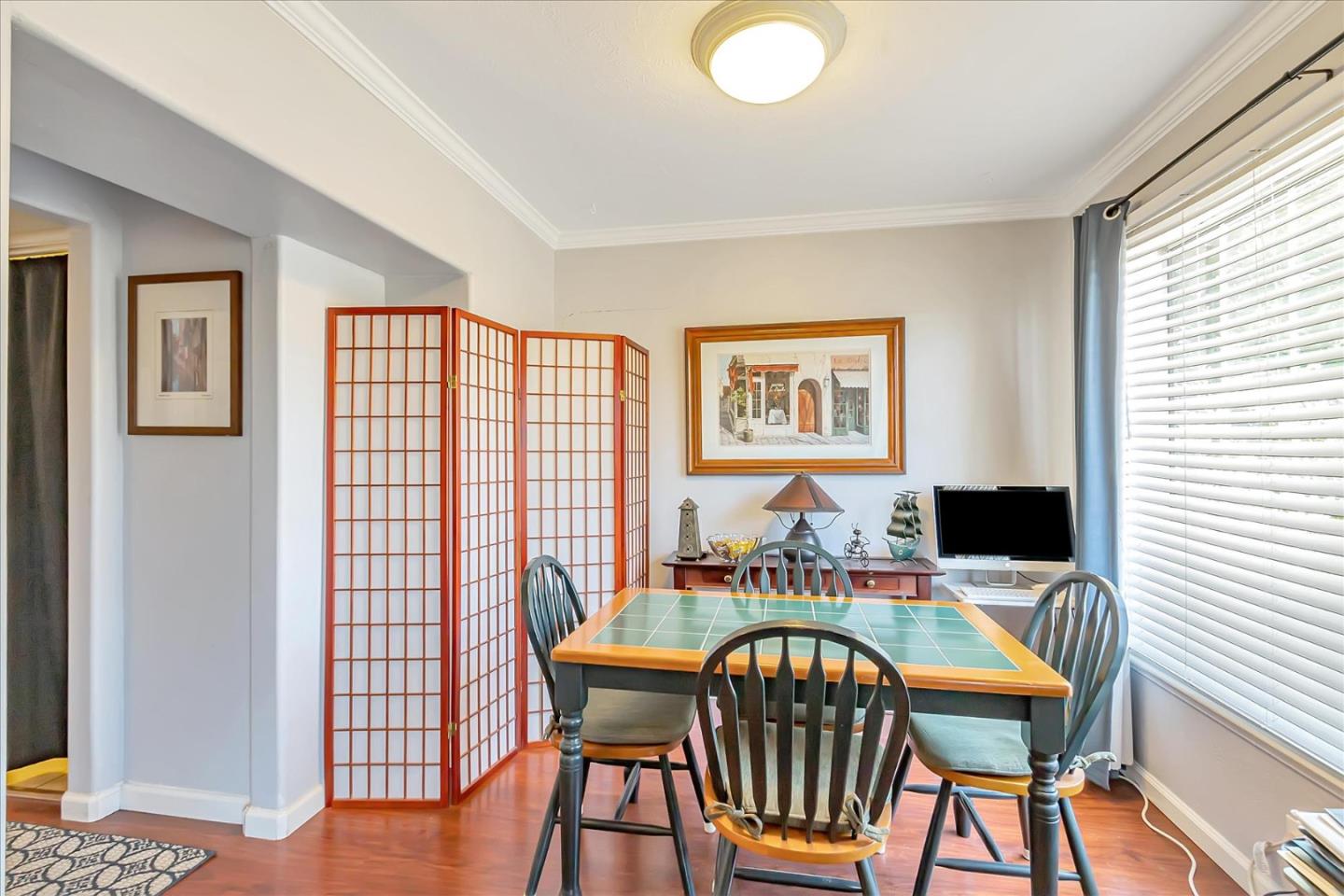 22620 Alcalde Road Cupertino, CA 95014 - Photo 18 of 39 a dining room with furniture and wooden floor