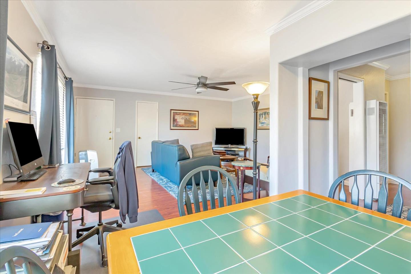 22620 Alcalde Road Cupertino, CA 95014 - Photo 19 of 39 a view of a workspace with furniture and a flat screen tv