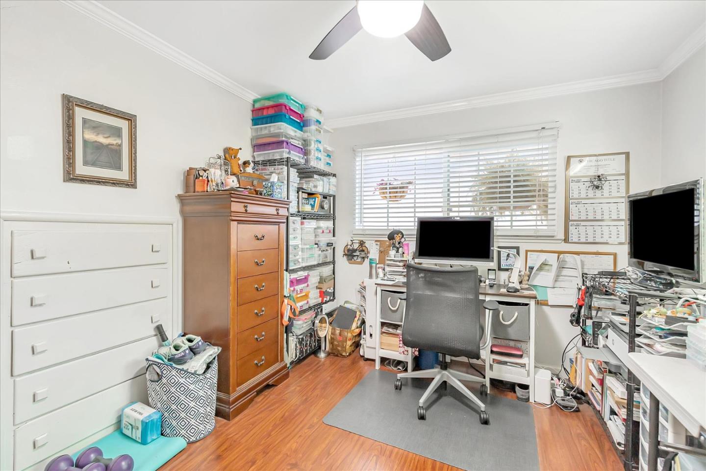 22620 Alcalde Road Cupertino, CA 95014 - Photo 21 of 39 a view of a workspace with furniture and a flat screen tv