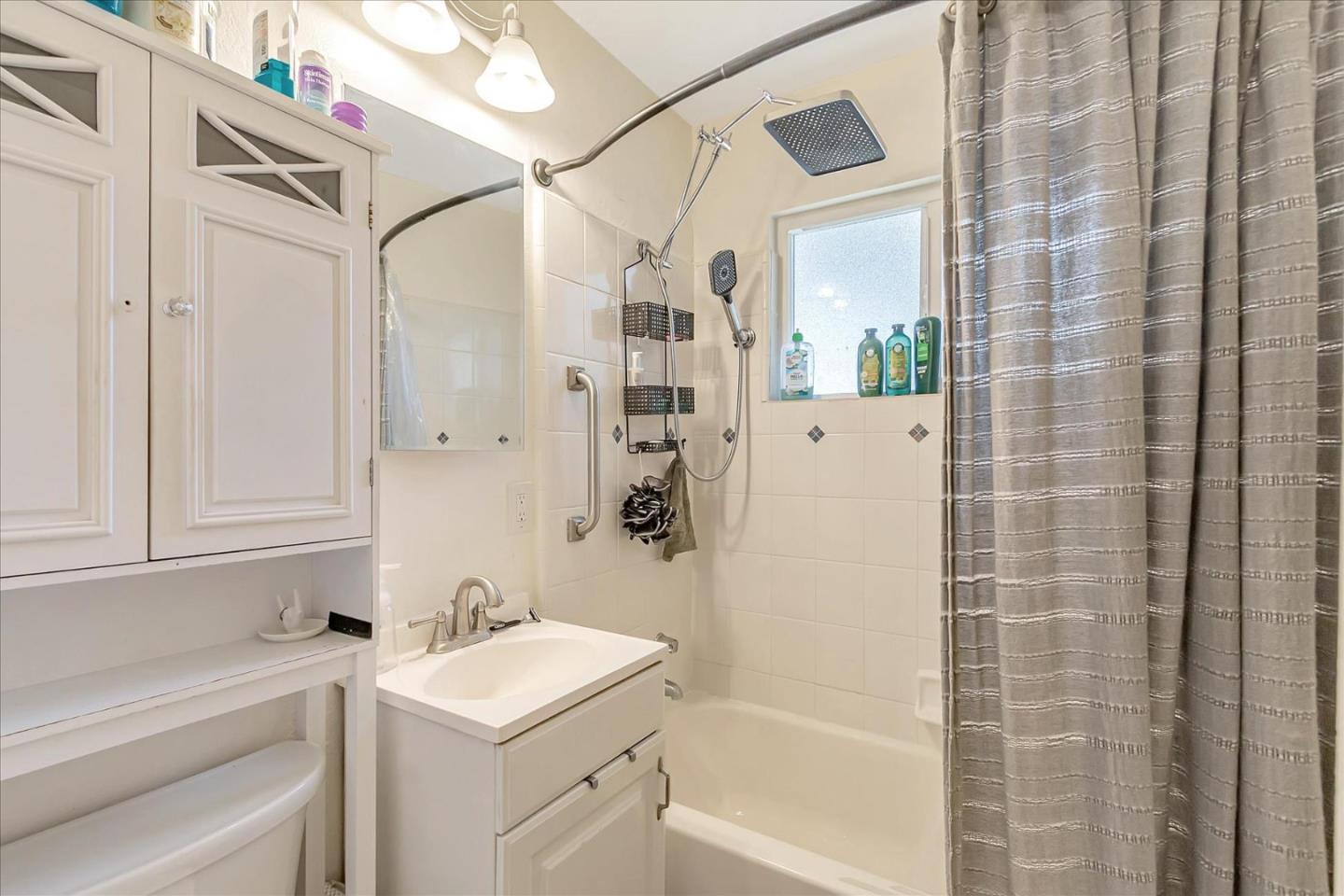 22620 Alcalde Road Cupertino, CA 95014 - Photo 28 of 39 a bathroom with a sink a toilet and shower