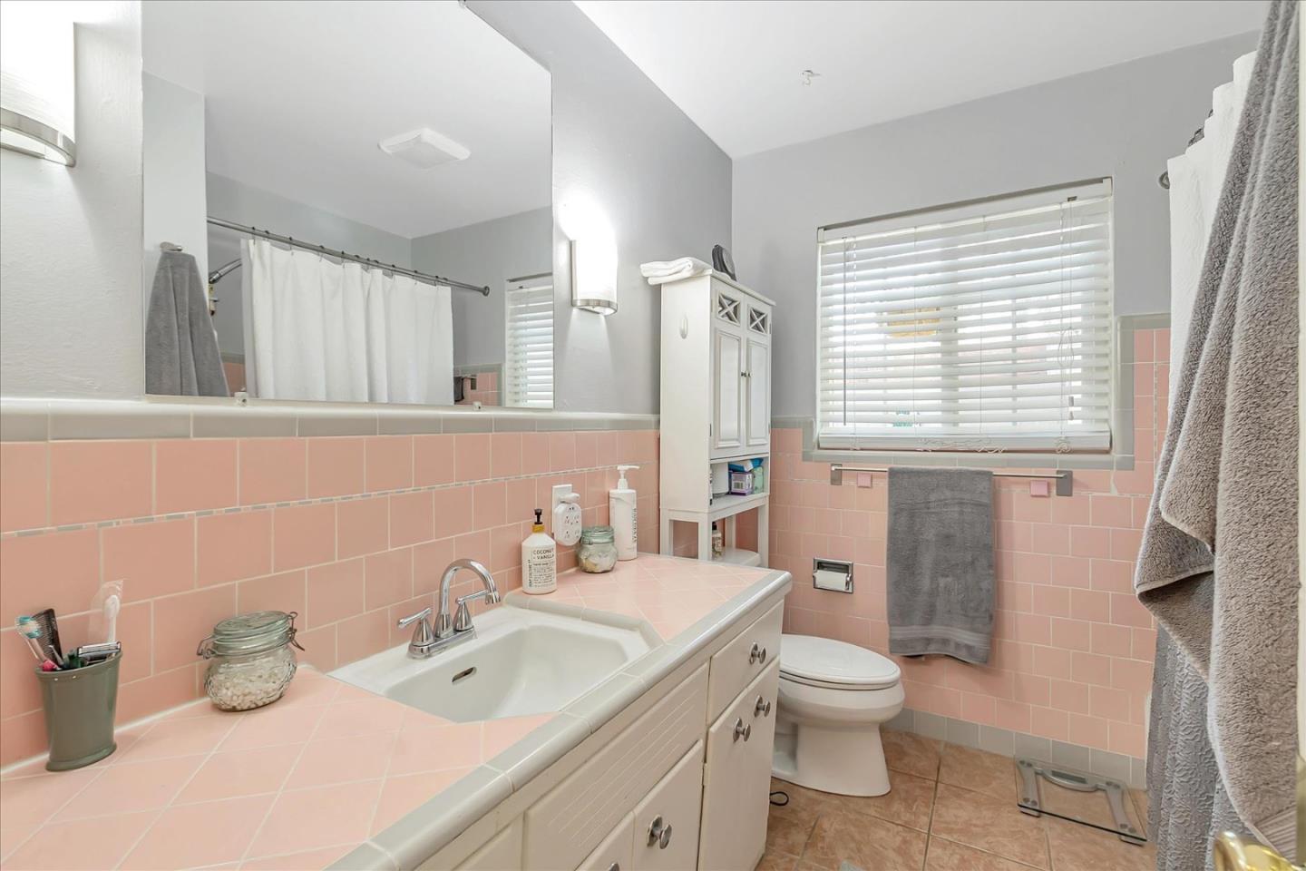 22620 Alcalde Road Cupertino, CA 95014 - Photo 29 of 39 a bathroom with a toilet sink and mirror