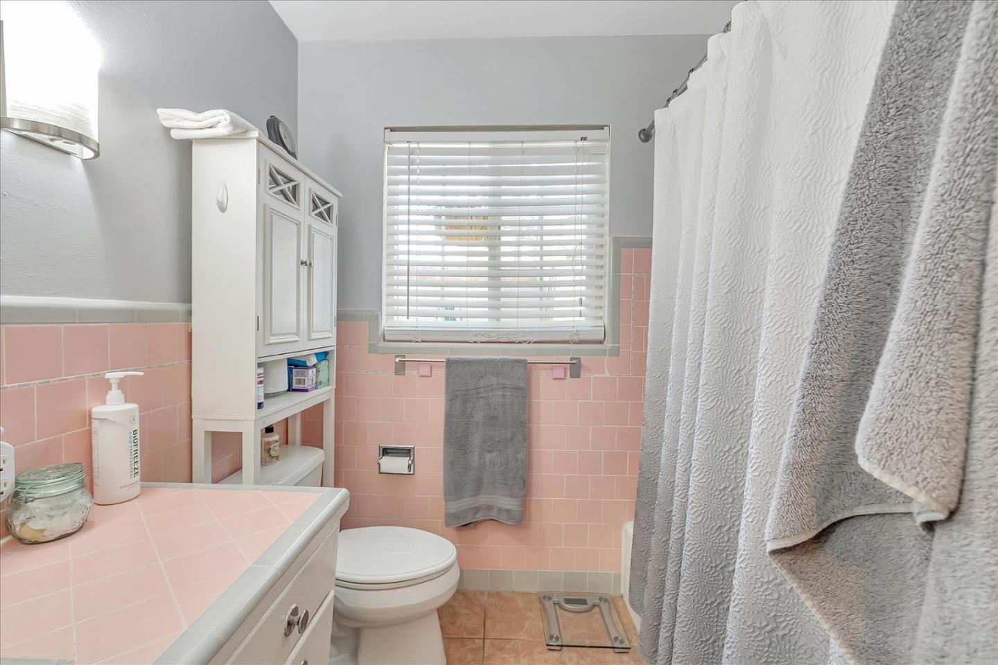 22620 Alcalde Road Cupertino, CA 95014 - Photo 30 of 39 a bathroom with a granite countertop toilet a sink and a bathtub