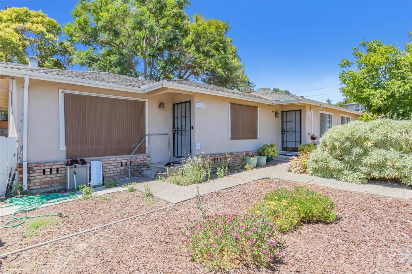 22620 Alcalde Road Cupertino, CA 95014 - Photo 3 of 39 a front view of a house with garden