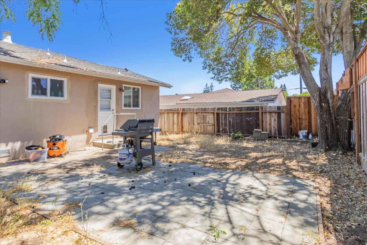 22620 Alcalde Road Cupertino, CA 95014 - Photo 33 of 39 a backyard of a house with table and chairs