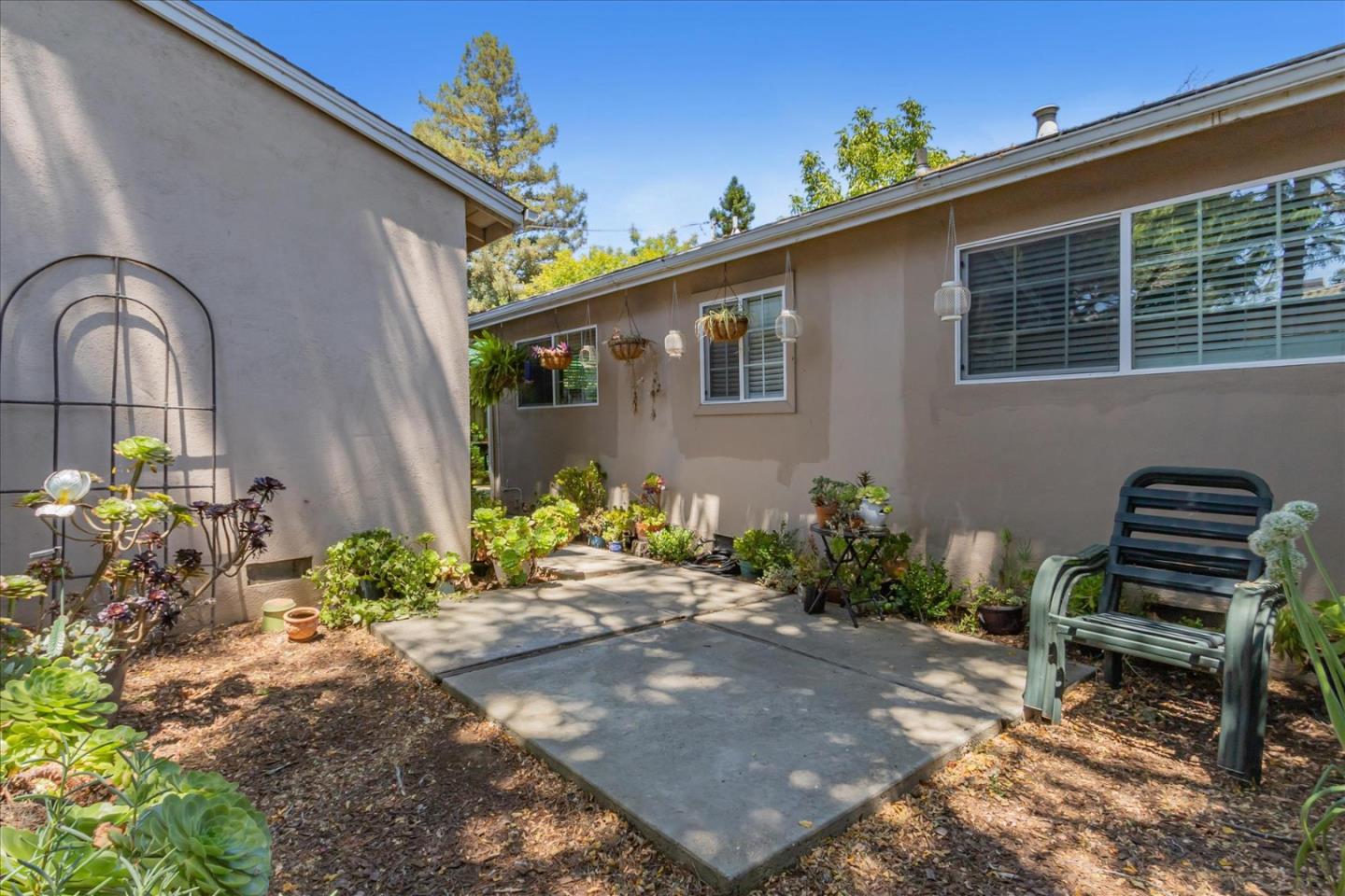 22620 Alcalde Road Cupertino, CA 95014 - Photo 35 of 39 a front view of a house with outdoor seating