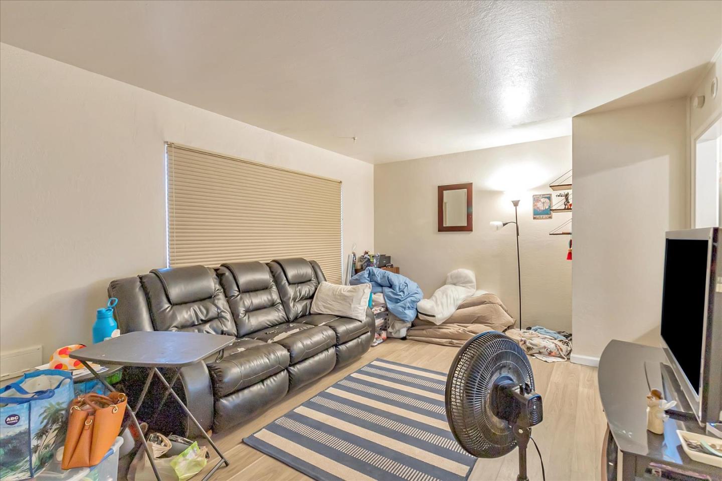 22620 Alcalde Road Cupertino, CA 95014 - Photo 6 of 39 a living room with furniture a flat screen tv and a couch