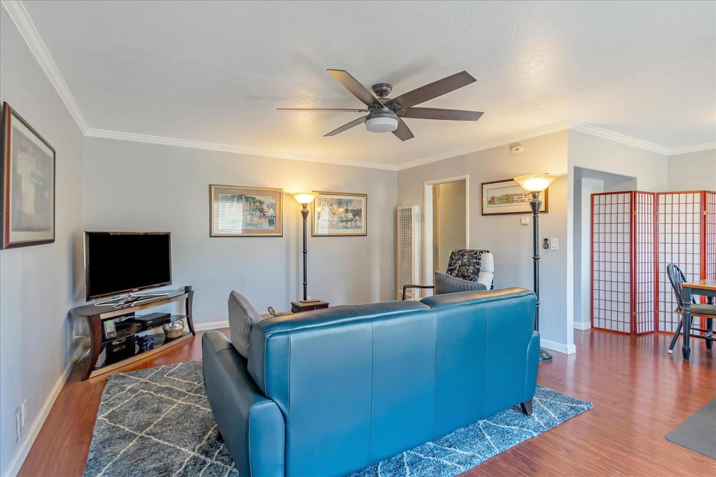 22620 Alcalde Road Cupertino, CA 95014 - Photo 8 of 39 a living room with furniture and a flat screen tv