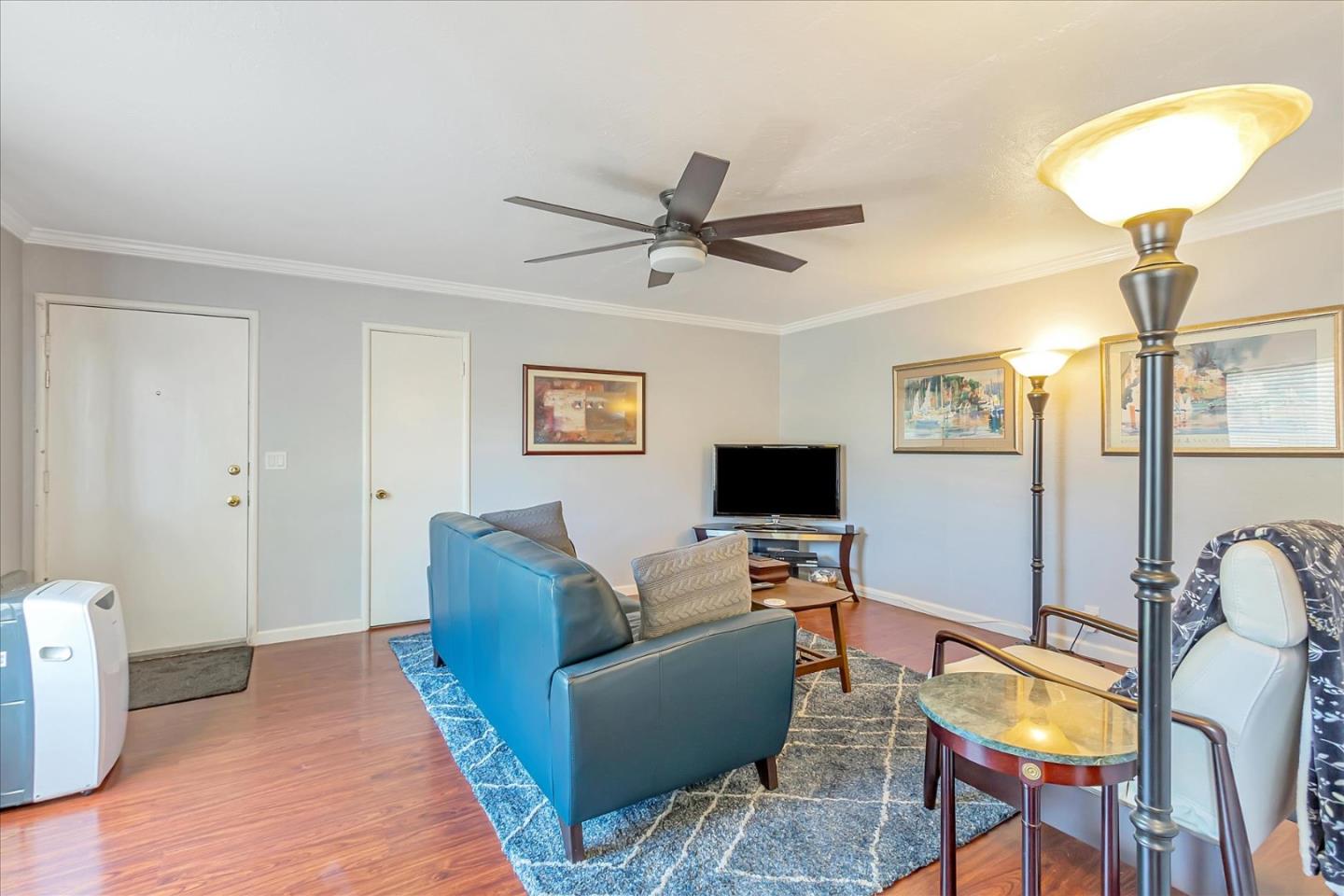 22620 Alcalde Road Cupertino, CA 95014 - Photo 10 of 39 a living room with furniture and a flat screen tv