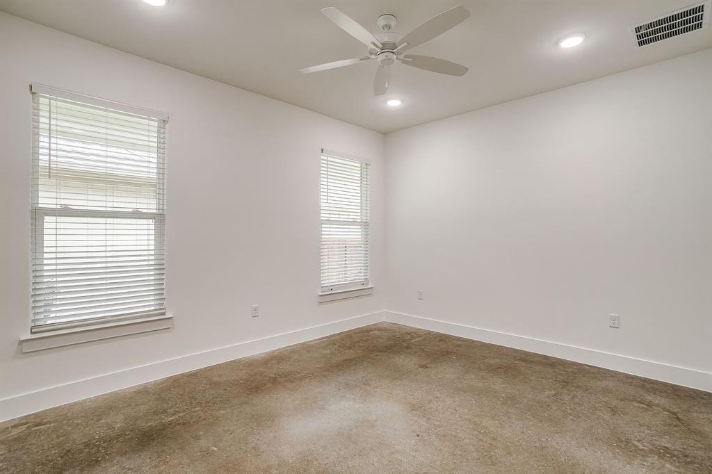 106 Cardinal Wds Granbury, TX 76049 - Photo 14 of 22 an empty room with a window and a fan