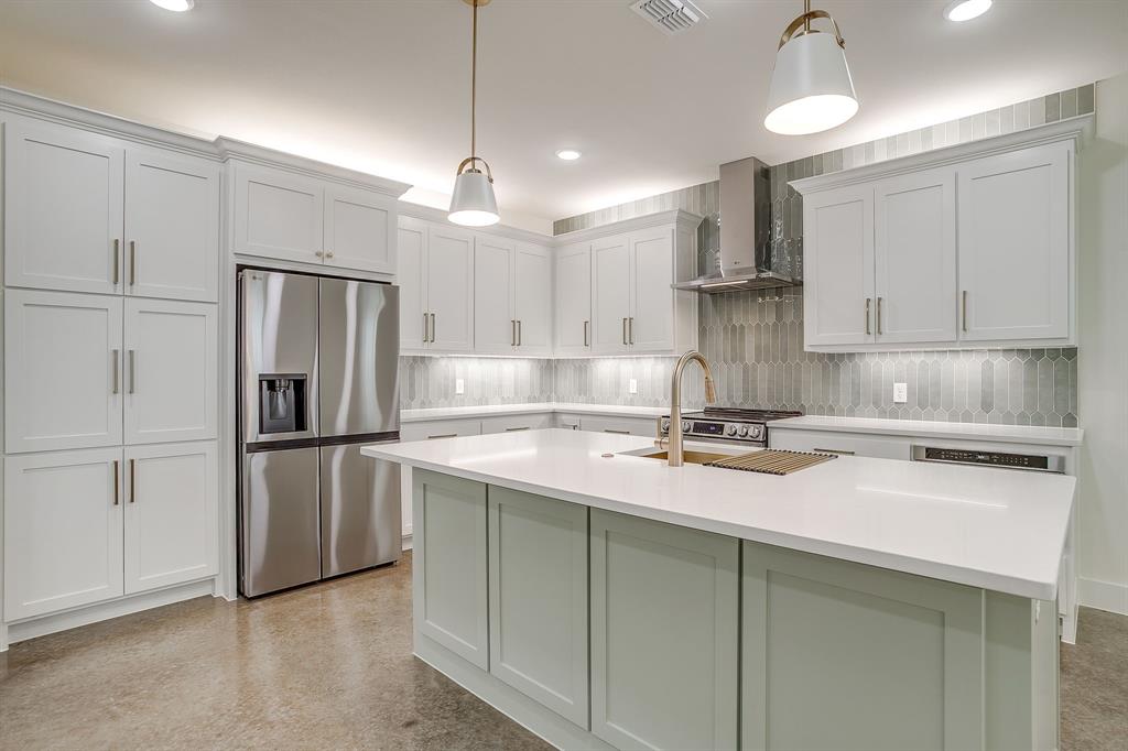 106 Cardinal Wds Granbury, TX 76049 - Photo 7 of 22 a kitchen with stainless steel appliances granite countertop a refrigerator a sink a stove and white cabinets